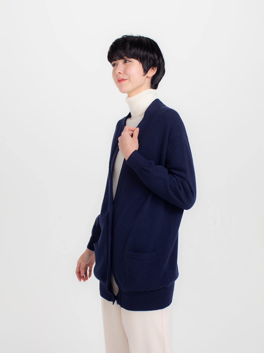 V-neck, middle-length, cardigan.